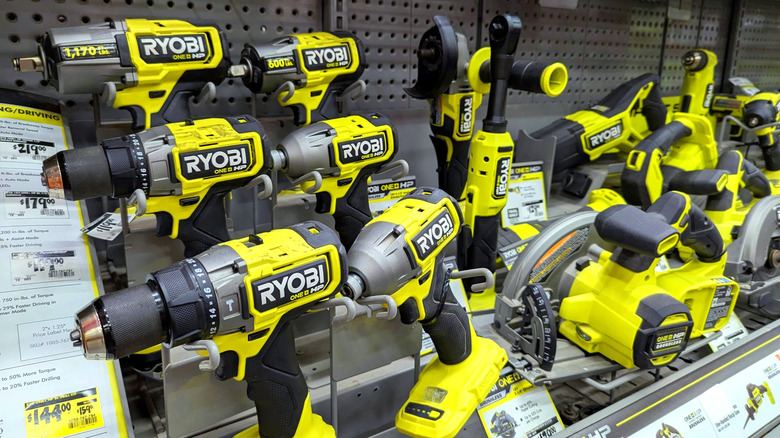 Many different Ryobi tools on display in a store.