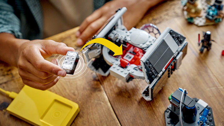 Child playing with LEGO Star Wars AI-powered smart brick tech toys