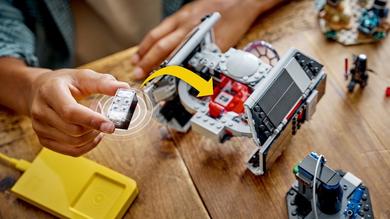 Child playing with LEGO Star Wars AI-powered smart brick tech toys