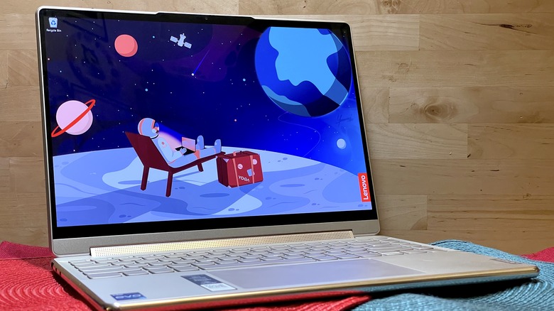 Lenovo Yoga 9i Gen 8 against wooden background