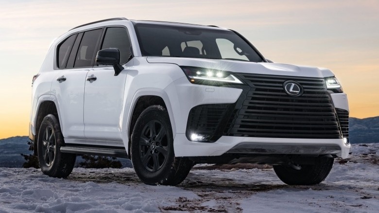 A white Lexus LX 600 Premium parked on a snowy surface