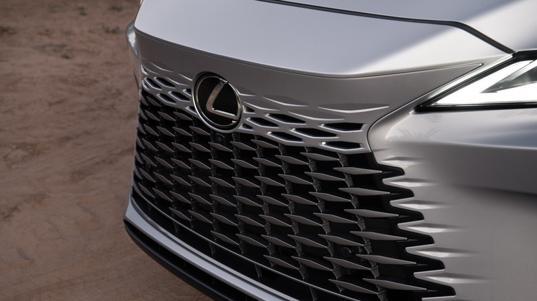 A close-up of a silver Lexus RX 350 front grille
