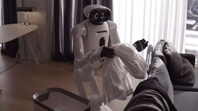LG's CLOiD robot picking up dirty laundry