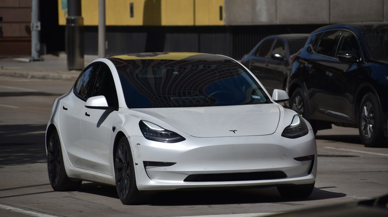 White Tesla Model Y on the road