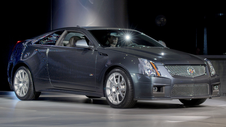 A gray Cadillac CTS-V Coupe at a car show, front 3/4 view