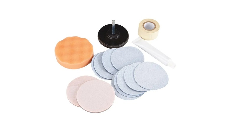 sanding and foam discs, drill attachment, tape, and foam