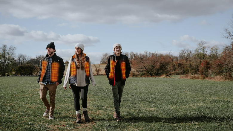 A shot of three Venture Heat heated jackets being worn