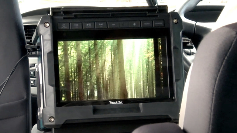 Makita rechargeable TV being used inside a car