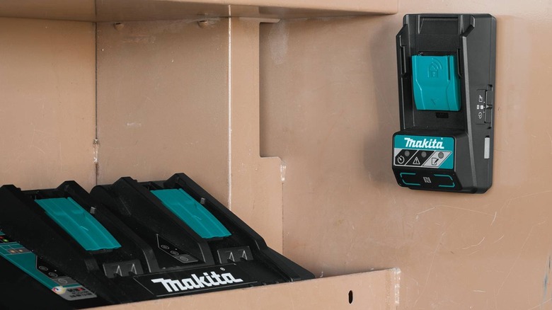 Makita Sync Lock battery terminal next to chargers