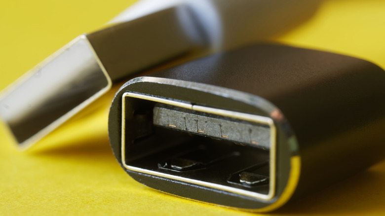 male and female USB ports on a yellow background