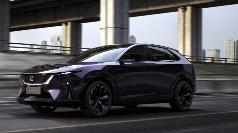 The Mazda EZ-60 crossover SUV photogoraphed on an urban freeway