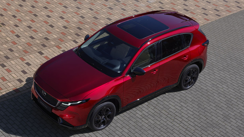 Overhead front 3/4 view of 2026 Mazda CX-5 on bricks