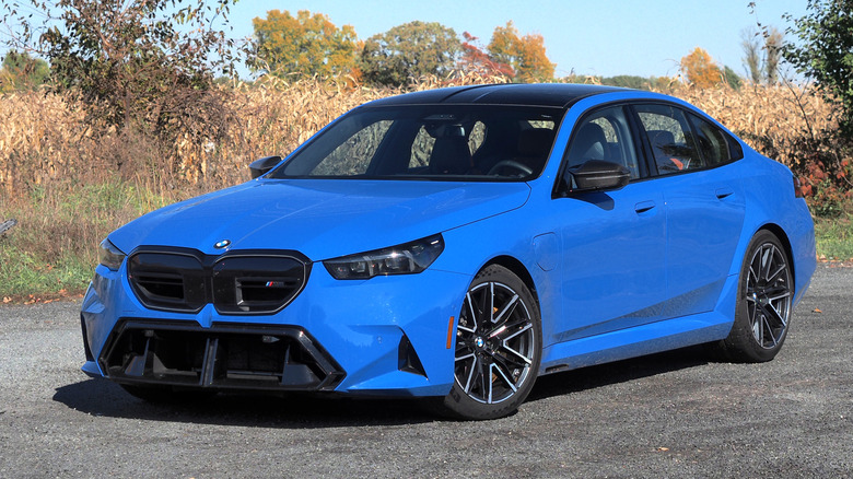 Blue BMW M5 parked at front 3/4 angle