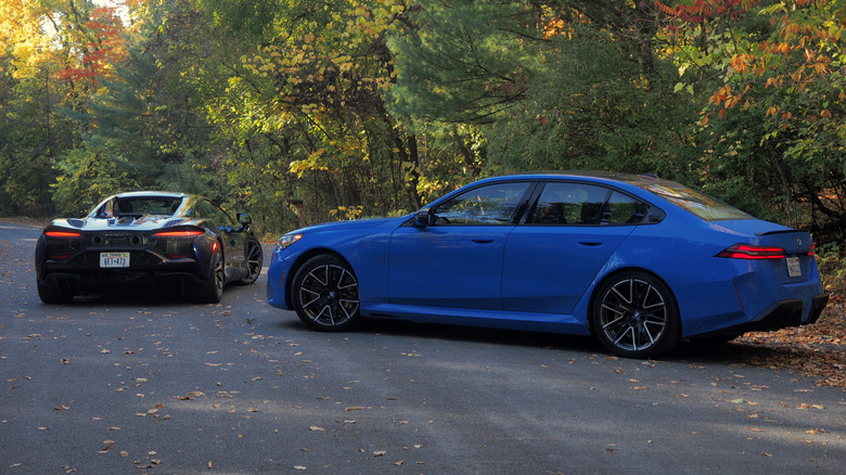 McLaren Artura Spider and BMW M5 rear view