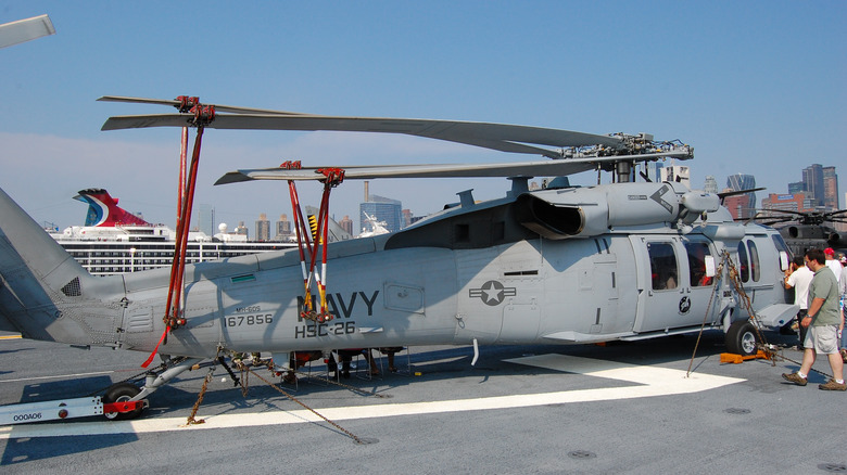 MH-60S Seahawk helicopter, wings folded back and stowed onboard Navy ship