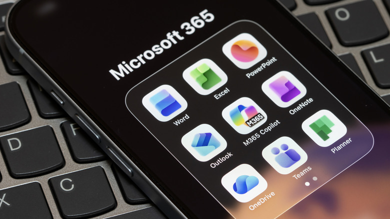 A smartphone with a folder of Microsoft 365 apps.