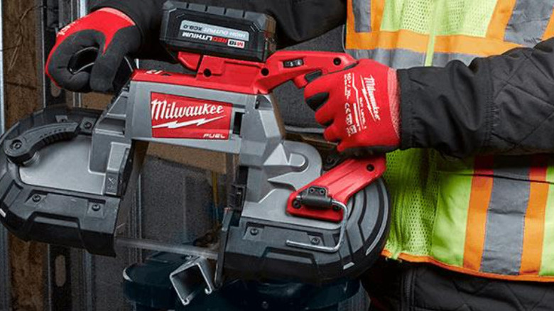 Man holding Milwaukee tool with M18 High Output battery