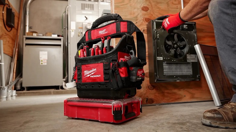 A Milwaukee packout structured 10-inch tote on a jobsite