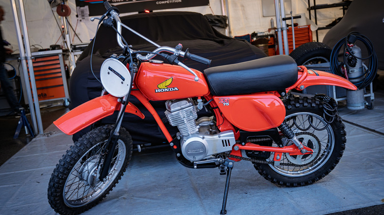 Closeup of a classic red Honda XR75 mini bike on display