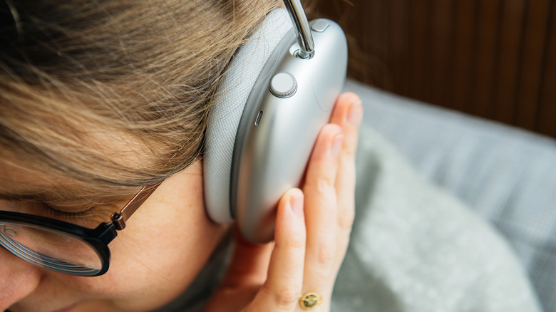 A woman focusing on sound quality 