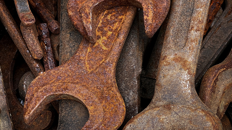 Several wrenches covered in rust.