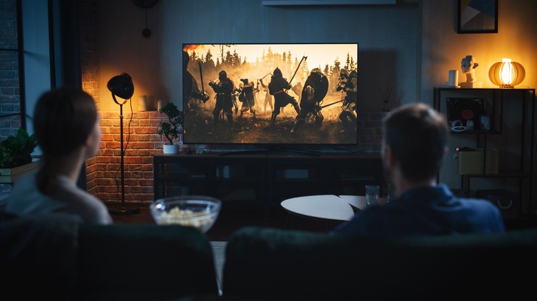 Two people watching TV