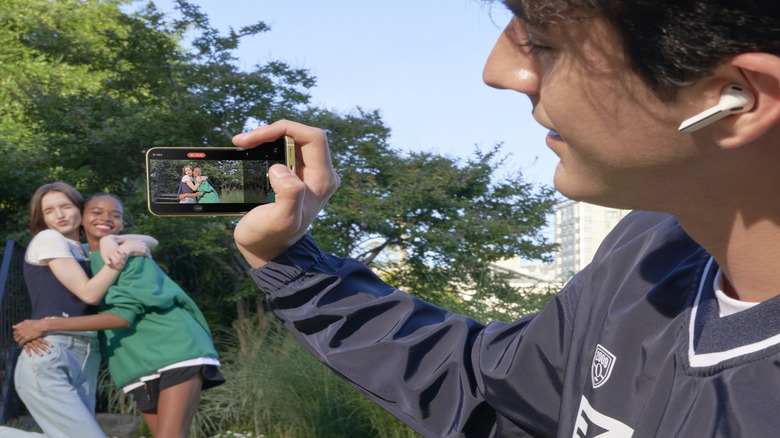 Man shooting a video while wearing Galaxy Buds3 Pro