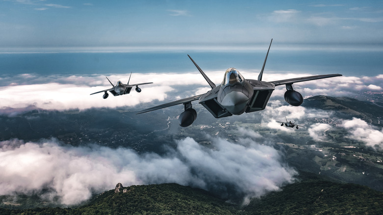 Jet fighters flying over the clouds..