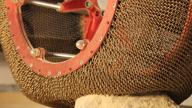 SMA tire moving over rock and showing flexibility