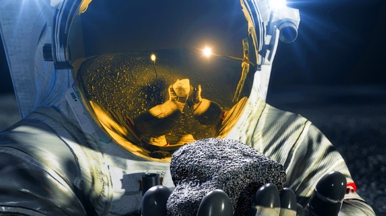 Artist illustration of astronauts in spacesuits on the moon