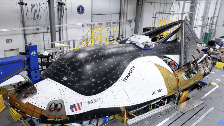 Dream Chaser Tenacity with wings folded on platform at Kennedy Space Center