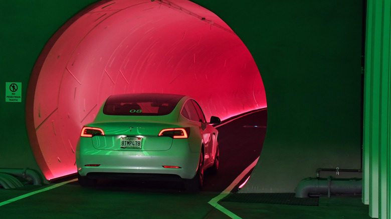 White Tesla heading into Boring Co. tunnel
