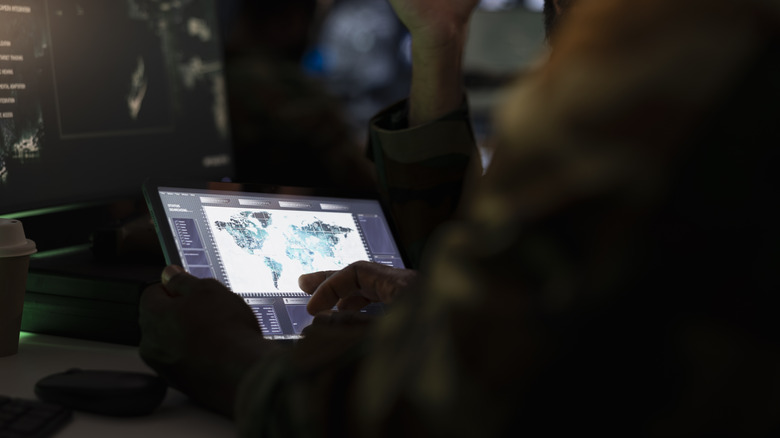 army looking at world map data