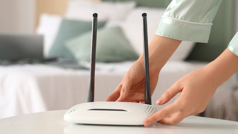 Woman with wi-fi router