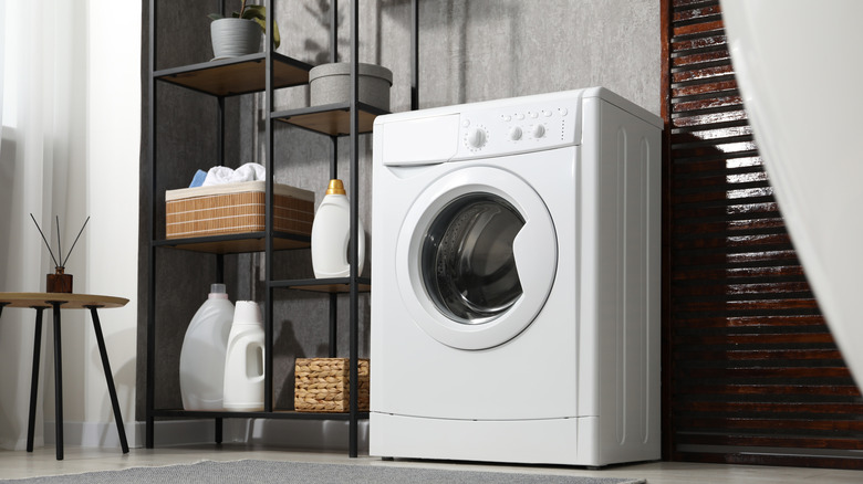 A washing machine in a bathroom