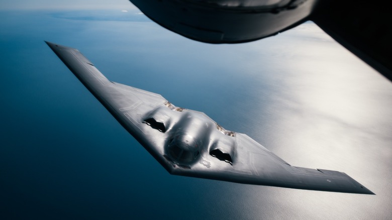 A B-2 Spirit in flight over the ocean