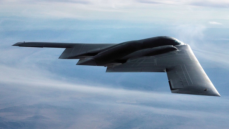 A B-2 Spirit in flight over the desert