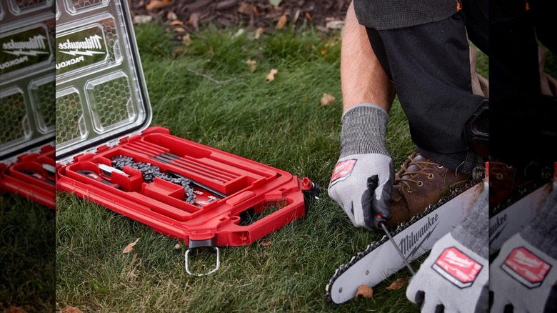 Person uses Milwaukee 9-piece Saw Chain Sharpening Set on a chainsaw