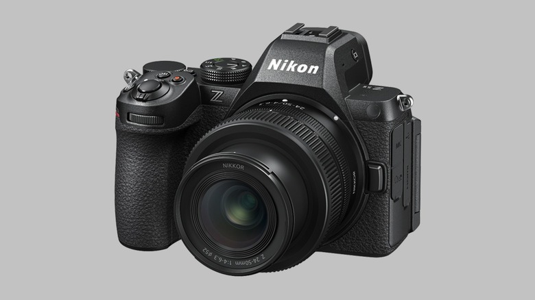 A Nikon Z5II with a Nikkor Z 24-50mm f/4-6.3 lens on a gray background