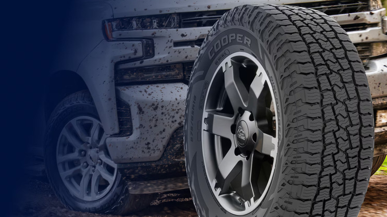 A Cooper-branded Tire shown, with chunky tread on silver large wheels