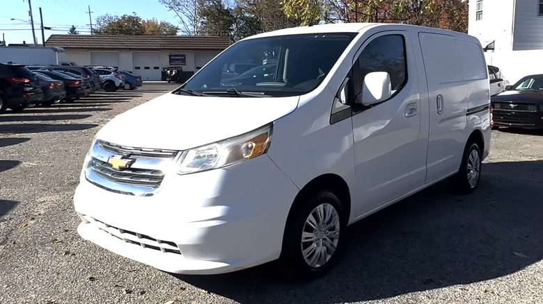 White Chevy City Express van parked in parking lot
