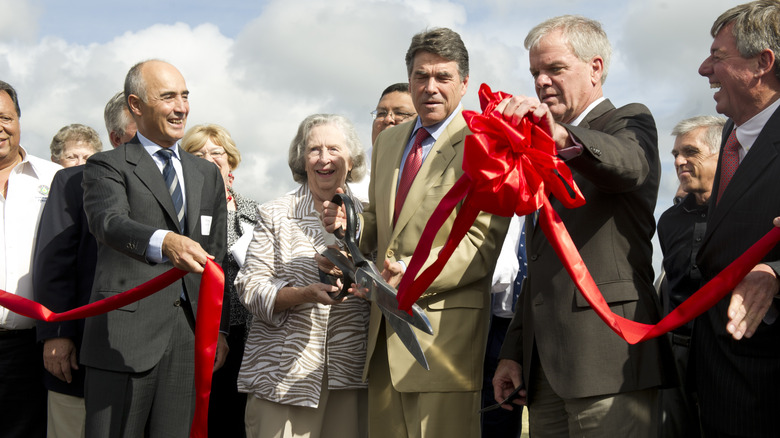 Then-Texas Gov. Rick Perry celebrates with Ferrovial's President Raphael del Pino y Calvo-Sotelo at the ribbon-cutting ceremony for State Highway 130.