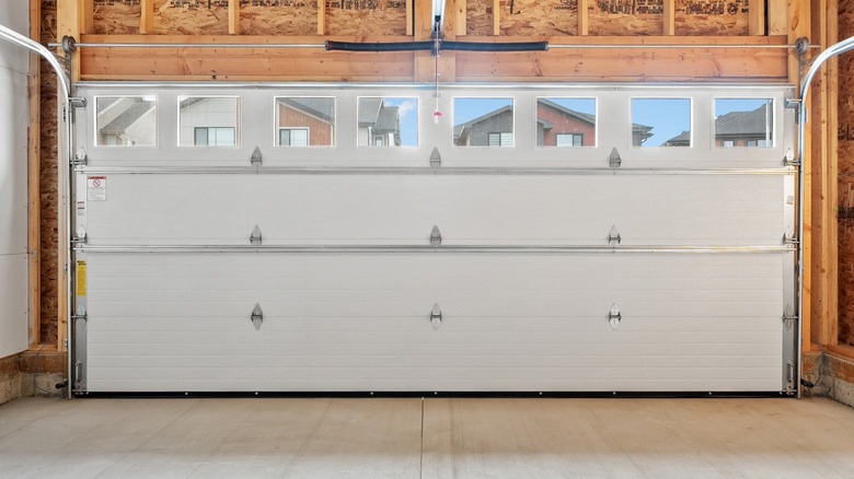 Garage with a white door closed