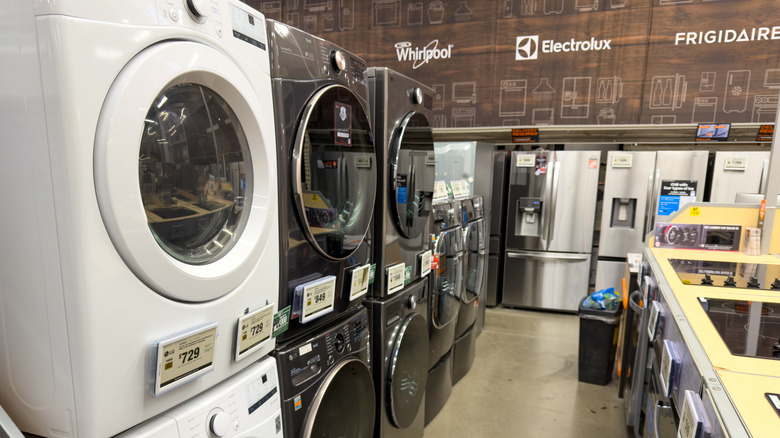 Front-loader washing machines and other appliances at a showroom display