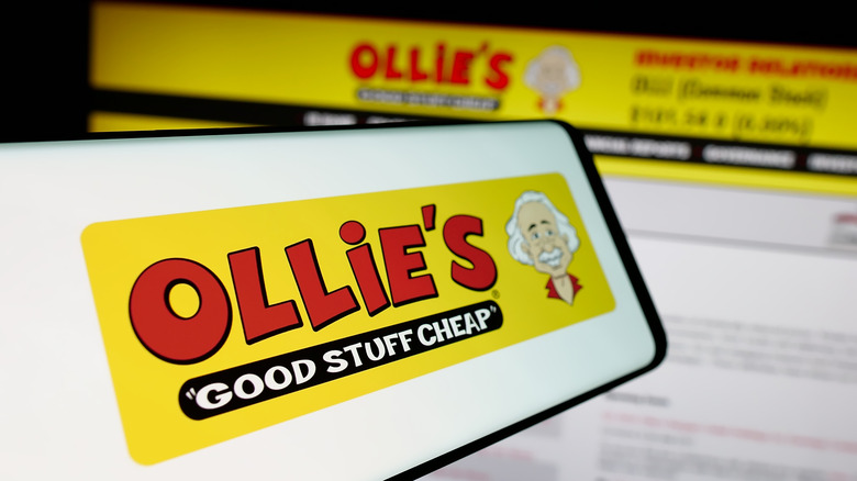 The Ollie's logo on a phone in front of a computer.