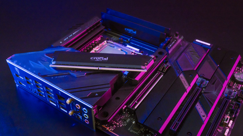 A stick of Micron Crucial RAM alongside a motherboard