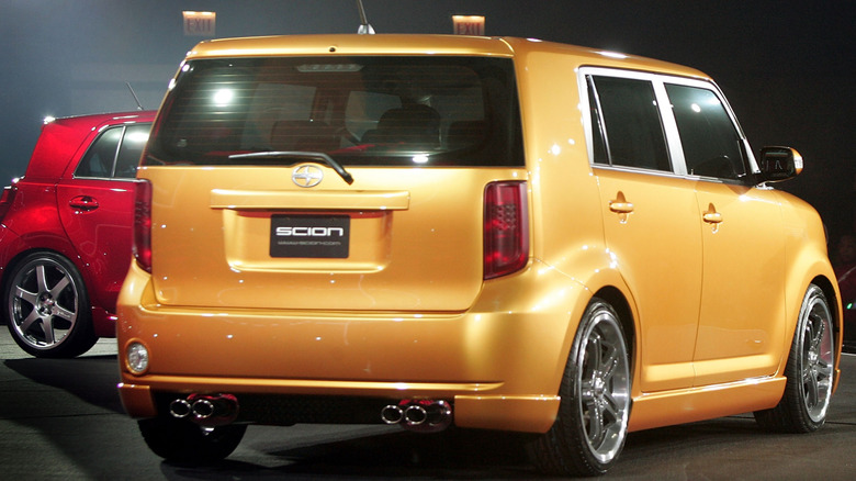 Gold and red Scion xD models on display.