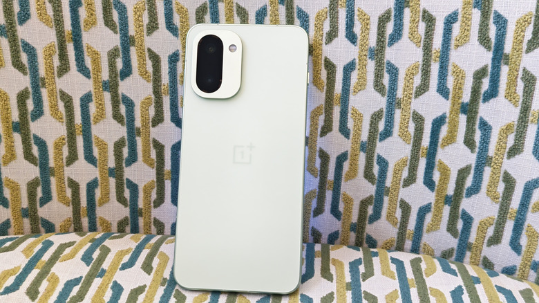 OnePlus 15R on a chair