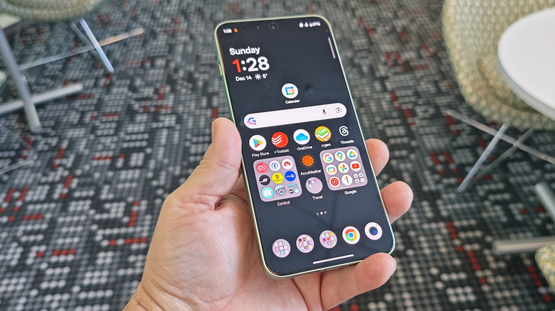 Man holding the OnePlus 15R