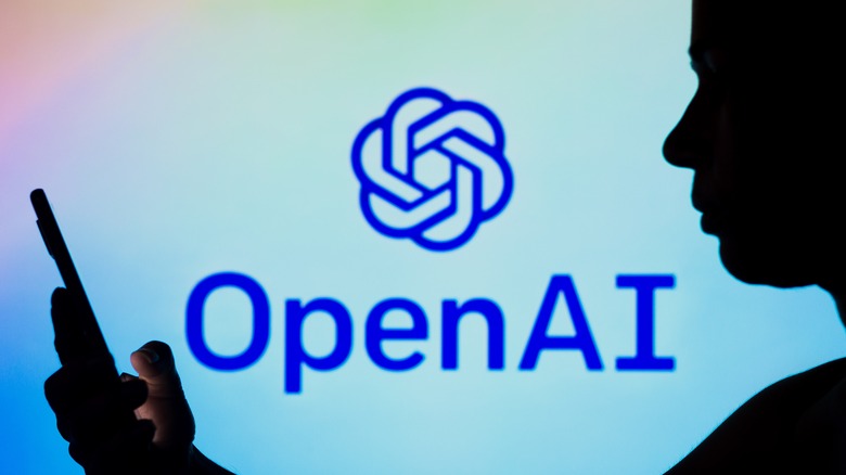 person using phone OpenAI logo